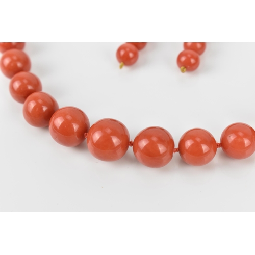 180 - An Italian 18ct yellow gold and red coral single strand bead necklace and pair of matching earrings,... 