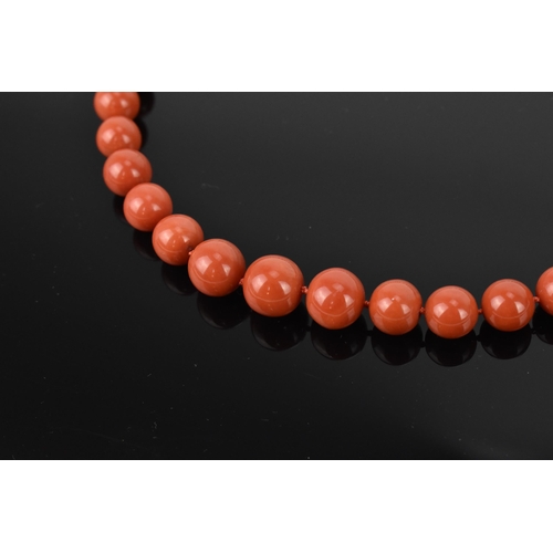 180 - An Italian 18ct yellow gold and red coral single strand bead necklace and pair of matching earrings,... 