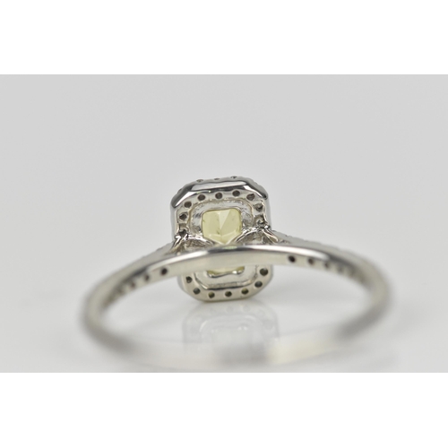 181 - A fancy intense yellow diamond and diamond cluster ring, the cut corner rectangular modern brilliant... 