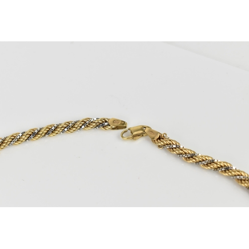 182 - A 9ct two tone gold ropetwist chain necklace, 57 cm long, stamped 375, 18.7 grams