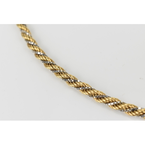 182 - A 9ct two tone gold ropetwist chain necklace, 57 cm long, stamped 375, 18.7 grams