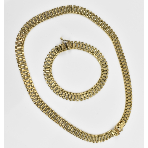 183 - An Italian 9ct yellow gold necklace and matching bracelet, with articulated flat brick links, with b... 