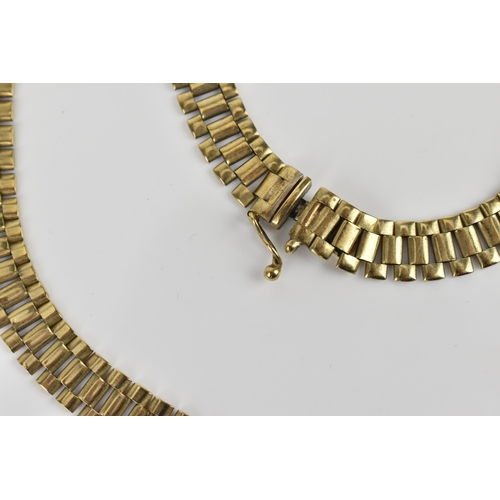 183 - An Italian 9ct yellow gold necklace and matching bracelet, with articulated flat brick links, with b... 