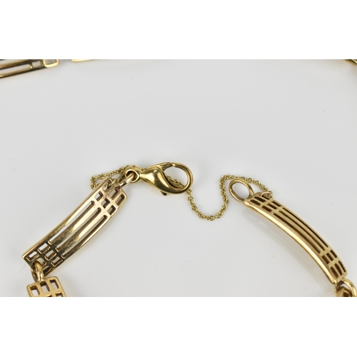 184 - A 9ct yellow gold gatelink necklace and matching bracelet, each with pierced rectangular links, the ... 