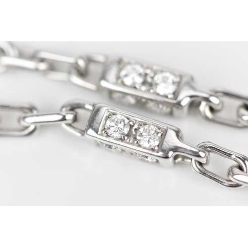 188 - An 18ct white gold and diamond necklace, with cable chain and cube links set with eight brilliant cu... 