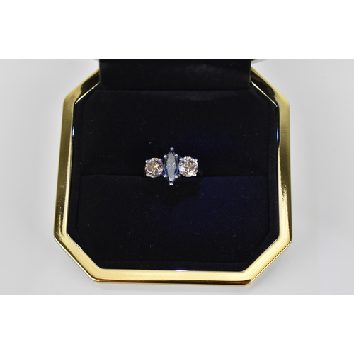 190 - A platinum, diamond and blue diamond ring, with central marquise cut blue diamond flanked with a bri... 