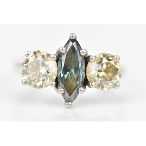 190 - A platinum, diamond and blue diamond ring, with central marquise cut blue diamond flanked with a bri... 