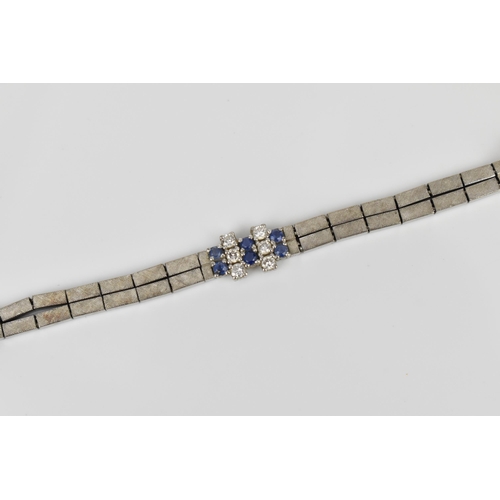 191 - An 18ct white gold, diamond and blue sapphire bracelet, the two articulated strands with six diamond... 