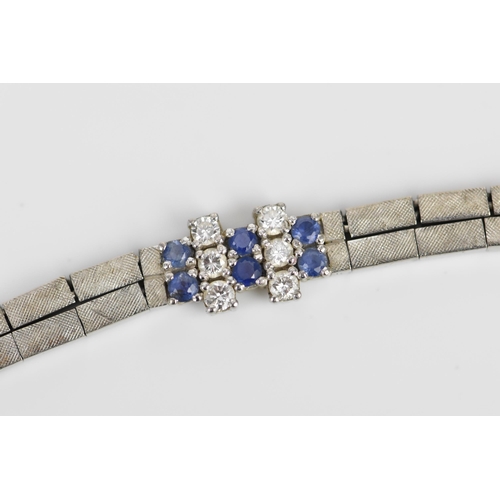 191 - An 18ct white gold, diamond and blue sapphire bracelet, the two articulated strands with six diamond... 