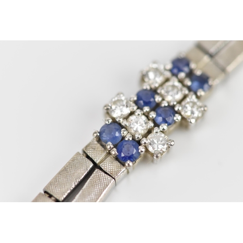 191 - An 18ct white gold, diamond and blue sapphire bracelet, the two articulated strands with six diamond... 