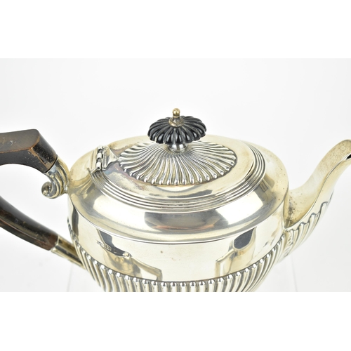 196 - An Edwardian silver three piece tea set by Lister & Hayden, Birmingham 1905, comrprising a teapot, t... 