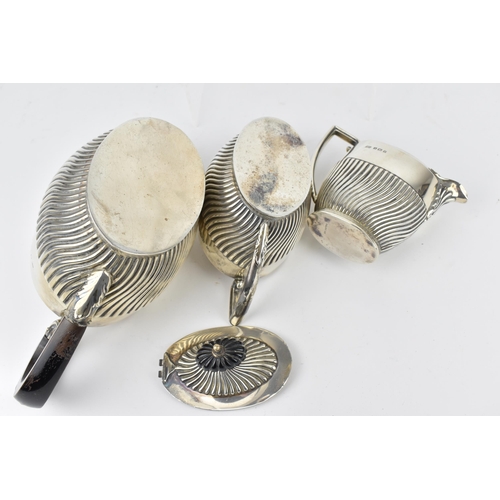 196 - An Edwardian silver three piece tea set by Lister & Hayden, Birmingham 1905, comrprising a teapot, t... 