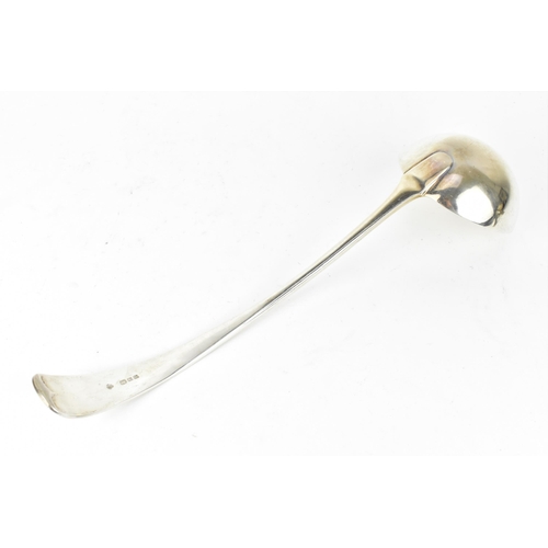 200 - A George V silver ladle by Harrods Ltd of London, 1930, in the Old English pattern, 31 cm long, weig... 