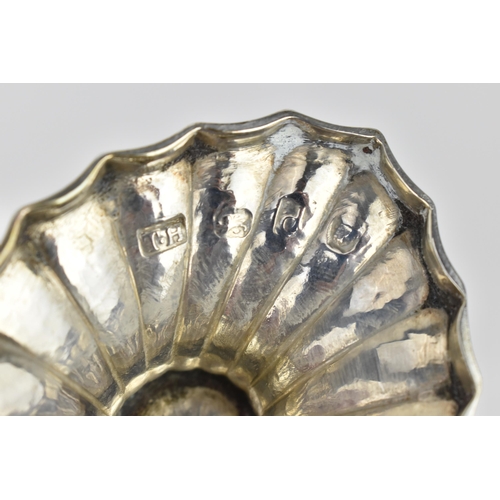 205 - A George III silver sugar bowl by Thomas Howell, London 1779, of fluted oval design, with swing hand... 