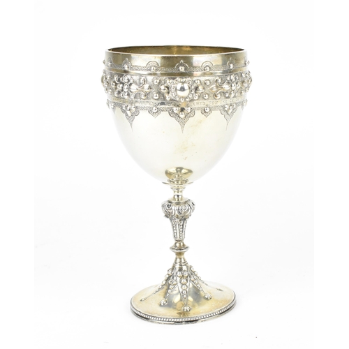 208 - A Victorian silver trophy goblet by  William Edwards, London 1870, the bowl with embossed stylised b... 