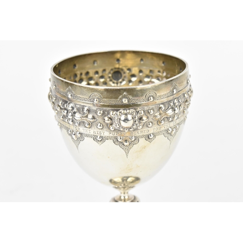 208 - A Victorian silver trophy goblet by  William Edwards, London 1870, the bowl with embossed stylised b... 