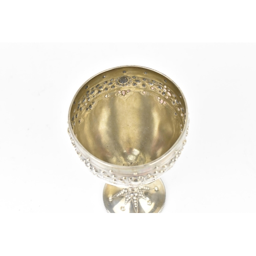 208 - A Victorian silver trophy goblet by  William Edwards, London 1870, the bowl with embossed stylised b... 