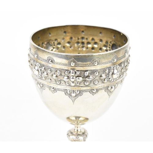 208 - A Victorian silver trophy goblet by  William Edwards, London 1870, the bowl with embossed stylised b... 