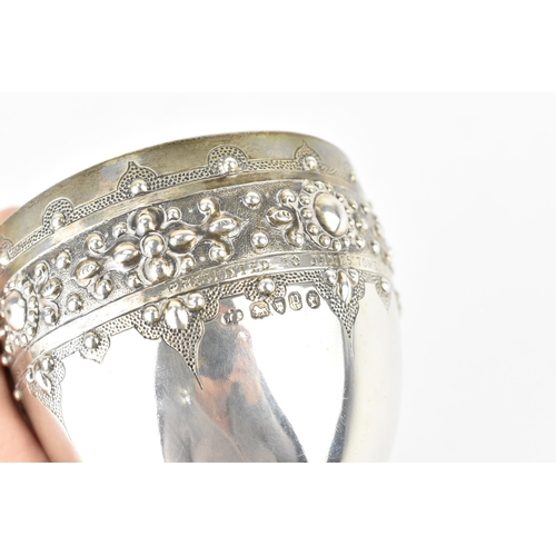 208 - A Victorian silver trophy goblet by  William Edwards, London 1870, the bowl with embossed stylised b... 