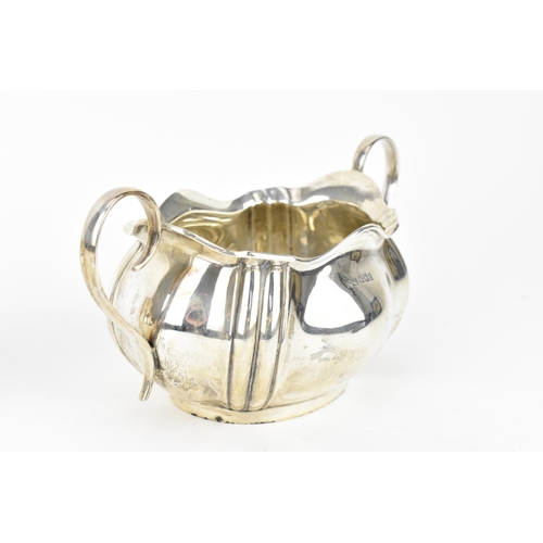 210 - A George V silver twin-handled sugar bowl, Sheffield 1916, with matching milk jug, makers initials P... 