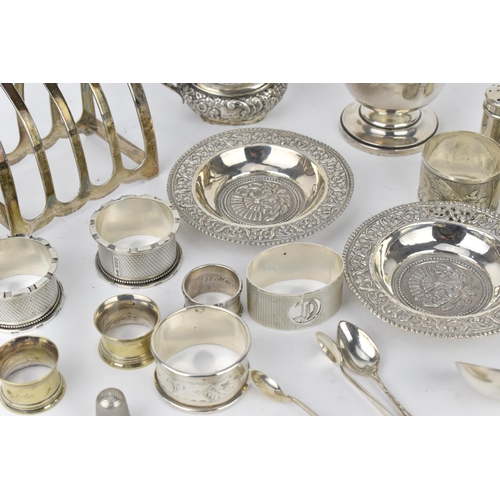 212 - A mixed lot of silver to include a George V silver sugar caster by Viner's Ltd, with matching toast ... 