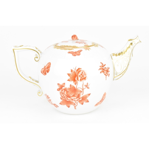 104 - A large Herend porcelain teapot, in the Chinese 'Apponyi' bouquet in orange, with woven effect to th... 