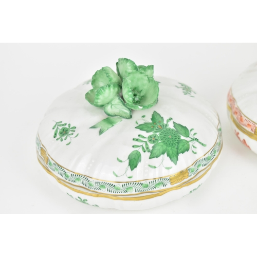 105 - Two Herend porcelain lidded boxes in the 'Apponyi' pattern, green and orange, each with Chinese bouq... 