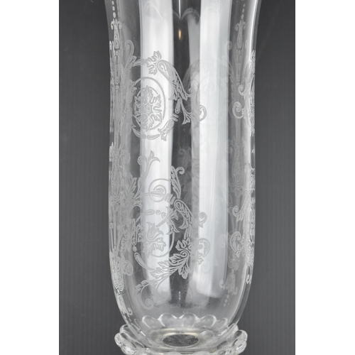 131 - A 20th century Baccarat moulded glass hurricane lamp in the 'dauphin' design, with etched glass shad... 