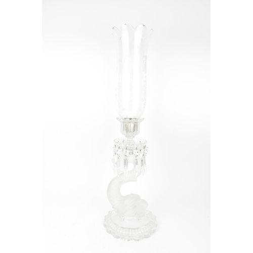 131 - A 20th century Baccarat moulded glass hurricane lamp in the 'dauphin' design, with etched glass shad... 