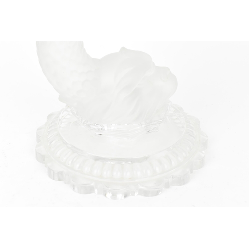 131 - A 20th century Baccarat moulded glass hurricane lamp in the 'dauphin' design, with etched glass shad... 