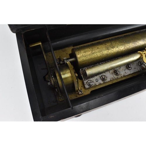 215 - A late 19th century inlaid cylinder music box, playing eight airs, the brass cylinder with graduated... 