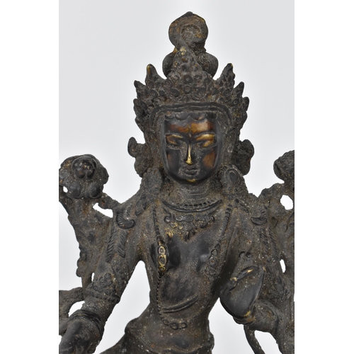 218 - A 19th century Sino-Tibetan cast bronze model of green Tara Buddha, 19.5 cm high