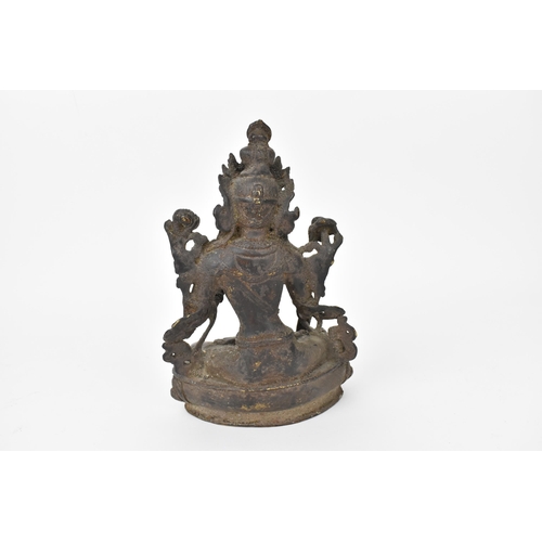 218 - A 19th century Sino-Tibetan cast bronze model of green Tara Buddha, 19.5 cm high