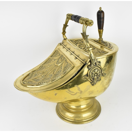 225 - A 19th century Regency period brass coal scuttle, with shovel, the top with embossed acanthus leaf s... 