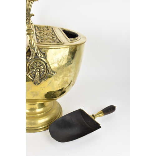 225 - A 19th century Regency period brass coal scuttle, with shovel, the top with embossed acanthus leaf s... 