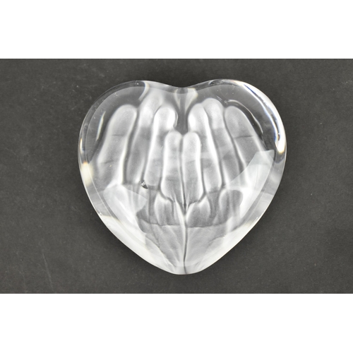 49 - A Daum glass paperweight designed by Tony Morgan, in the shape of a heart with frosted hand print to... 