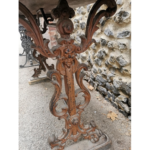 164 - A Victorian cast iron rectangular pub table with a mahogany top, over brown painted pierced, scrolle... 