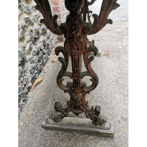 164 - A Victorian cast iron rectangular pub table with a mahogany top, over brown painted pierced, scrolle... 