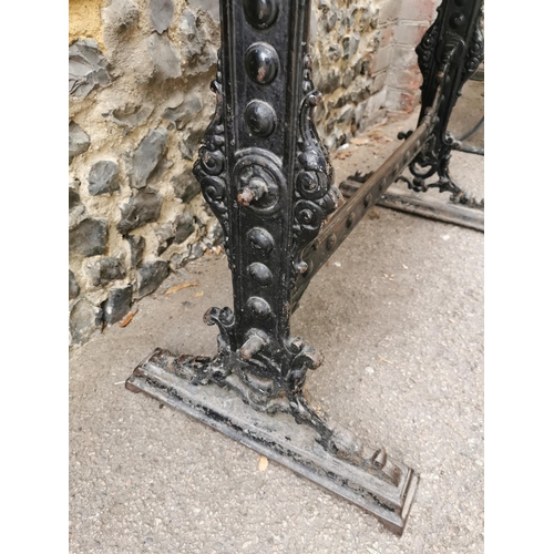 165 - A Victorian cast iron rectangular pub table, with a mahogany top, over a black painted pedestal base... 