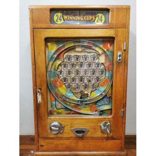 240 - A mid century Oliver Whales Allwin '24 winning cups' mechanical arcade machine, the penny slot with ... 