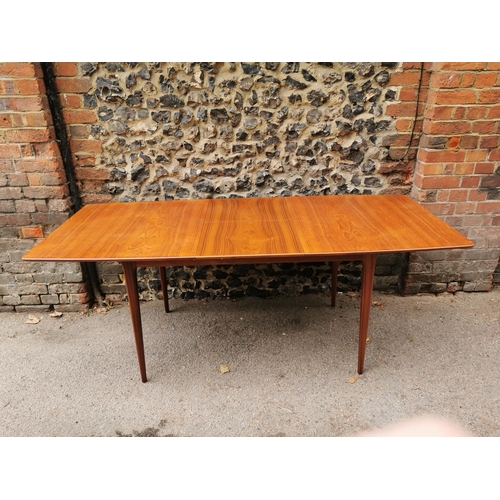 55 - A mid 20th century McIntosh teak dining suite, comprising a rectangular extending table with conceal... 