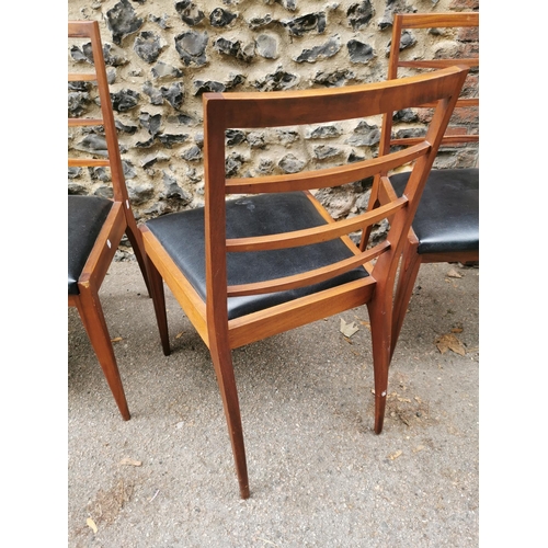 55 - A mid 20th century McIntosh teak dining suite, comprising a rectangular extending table with conceal... 