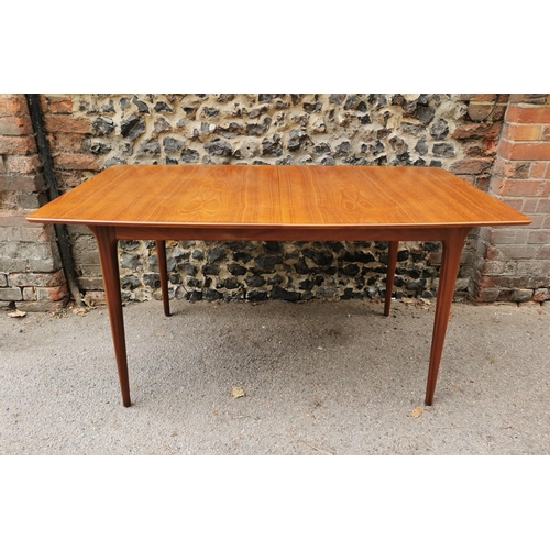 55 - A mid 20th century McIntosh teak dining suite, comprising a rectangular extending table with conceal... 