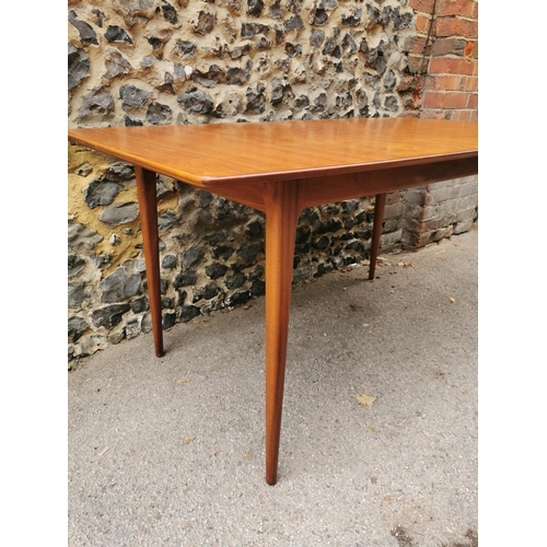 55 - A mid 20th century McIntosh teak dining suite, comprising a rectangular extending table with conceal... 