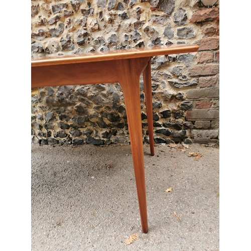 55 - A mid 20th century McIntosh teak dining suite, comprising a rectangular extending table with conceal... 