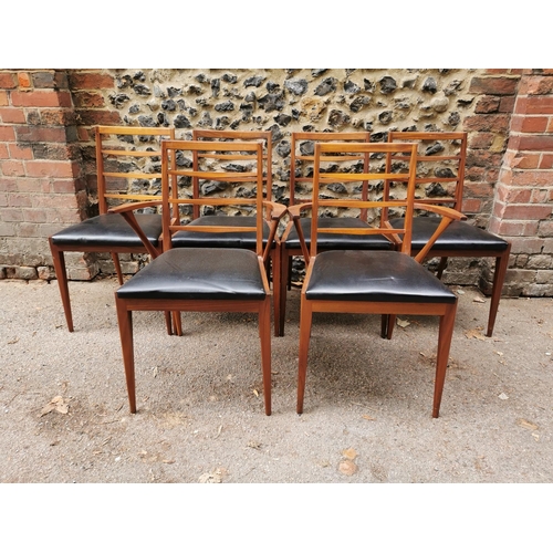 55 - A mid 20th century McIntosh teak dining suite, comprising a rectangular extending table with conceal... 