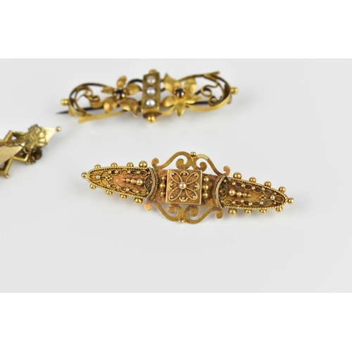 126 - A collection of three Victorian gold brooches, to include one 15ct yellow gold Etruscan revival broo... 