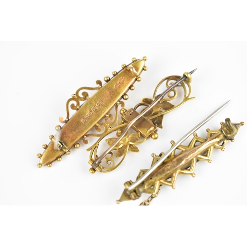 126 - A collection of three Victorian gold brooches, to include one 15ct yellow gold Etruscan revival broo... 