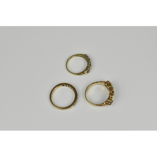 127 - A small group of dress rings, to include a 9ct yellow gold, garnet and white opal five stone ring, a... 