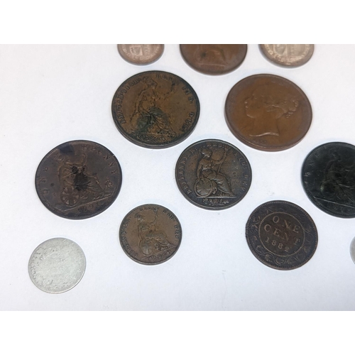 107 - A group of mostly Victorian British coinage to include 1857 and 1879 pennies, 1887 shilling and sixp... 